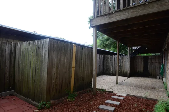 a view of outdoor space with wooden fence
