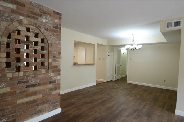 a view of a livingroom with wooden floor
