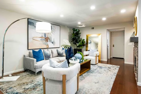 a living room with furniture and a table