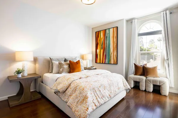 a bedroom with bed and a window
