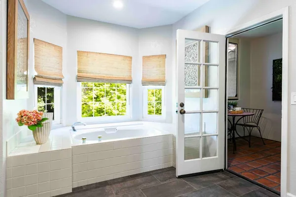 a bathroom with a tub and sink