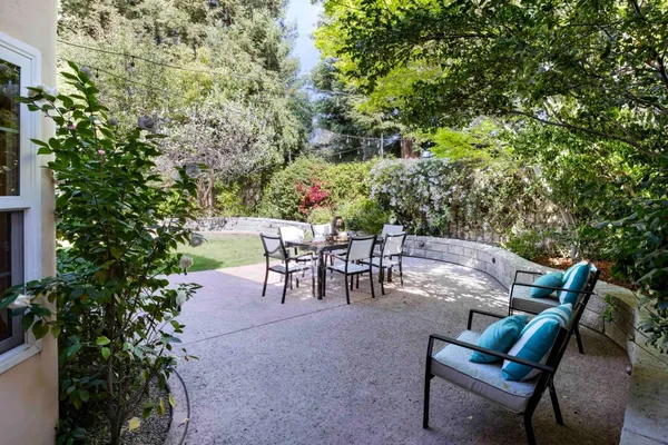 a view of a tables and chairs in a patio
