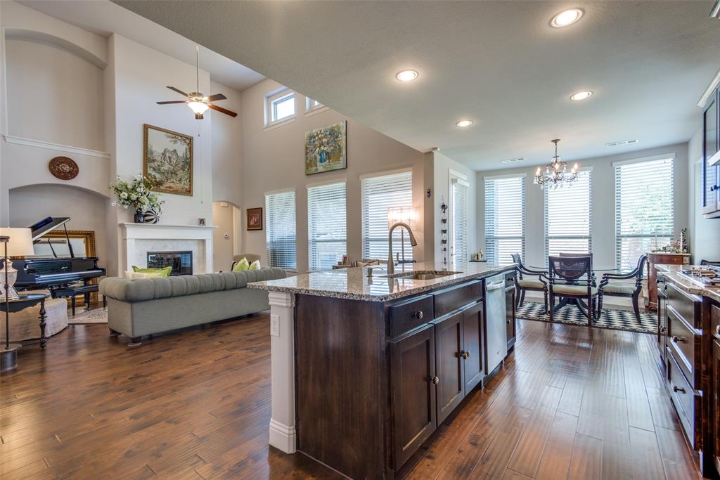 1320 Caliche Trail Allen, TX 75013 - Photo 14 of 25 a large kitchen with cabinets table and chairs