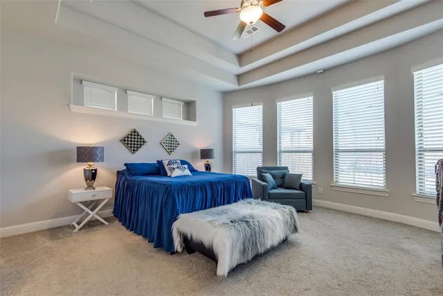 a bedroom with furniture and a window