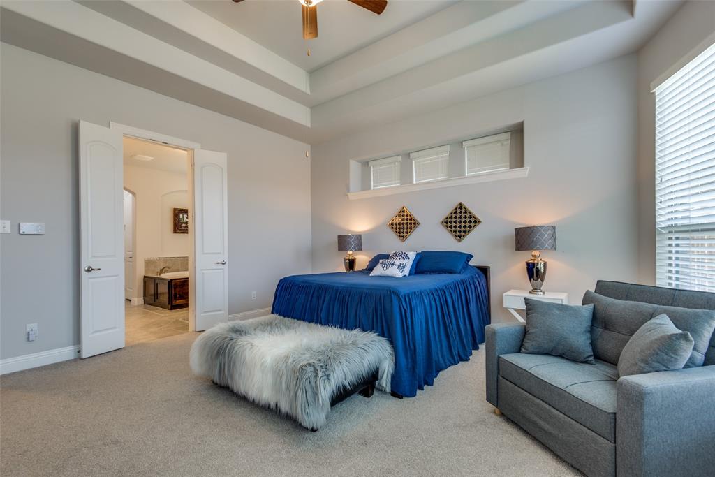 1320 Caliche Trail Allen, TX 75013 - Photo 16 of 25 a bedroom with a bed and wooden floor