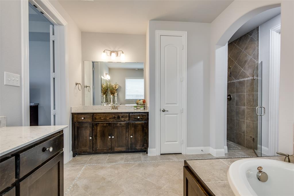 1320 Caliche Trail Allen, TX 75013 - Photo 18 of 25 a spacious bathroom with a tub double sink and mirror