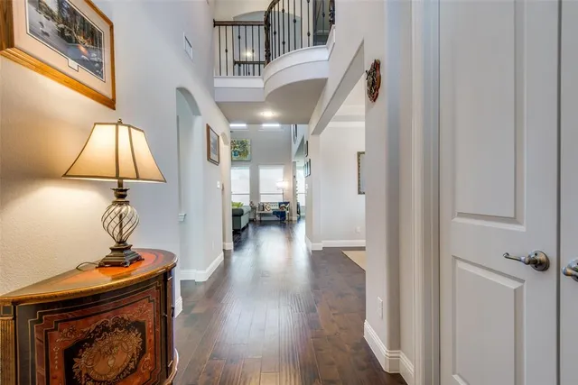 a view of entryway and hall with wooden floor