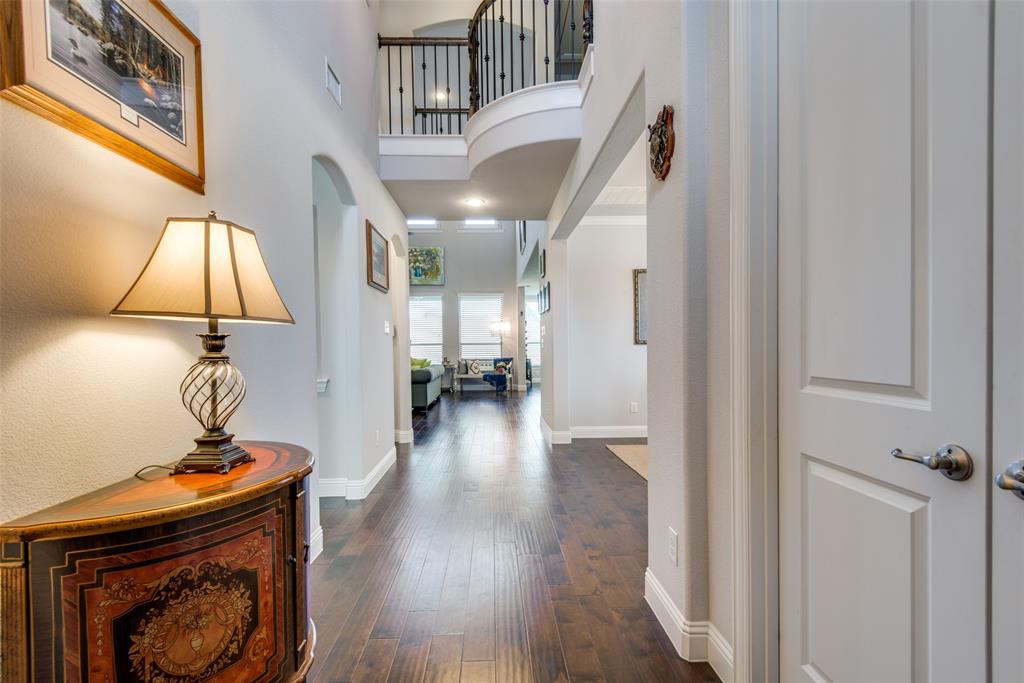 1320 Caliche Trail Allen, TX 75013 - Photo 4 of 25 a view of entryway and hall with wooden floor