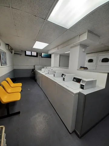 a kitchen with stainless steel appliances a stove a sink and a refrigerator