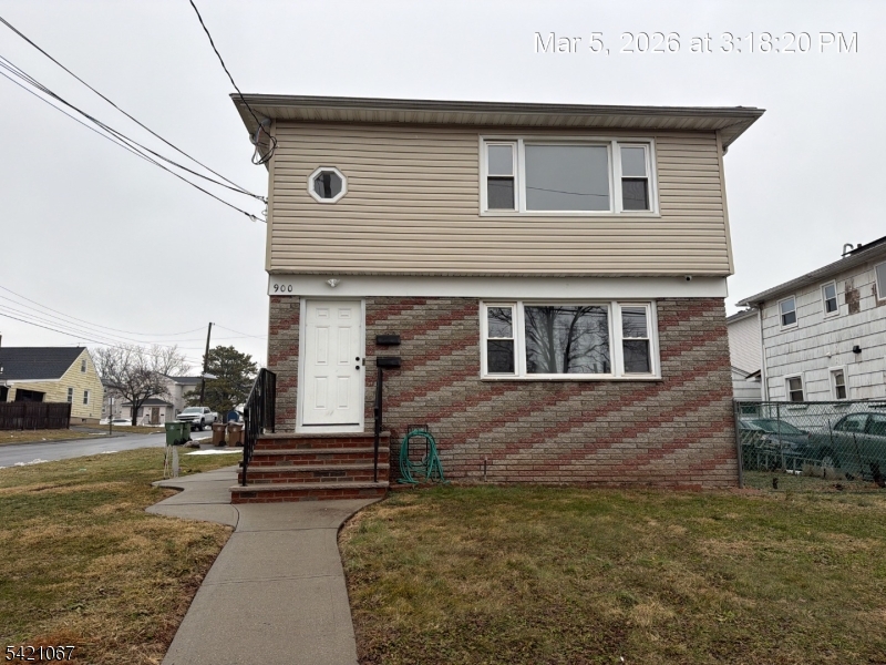 900 Smith Street, Unit 2 Linden, NJ 07036 - Photo 1 of 9 a front view of a house with a yard