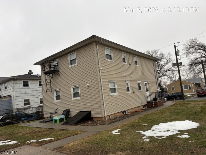 900 Smith Street, Unit 2 Linden, NJ 07036 - Photo 3 of 9 a front view of a house with a yard