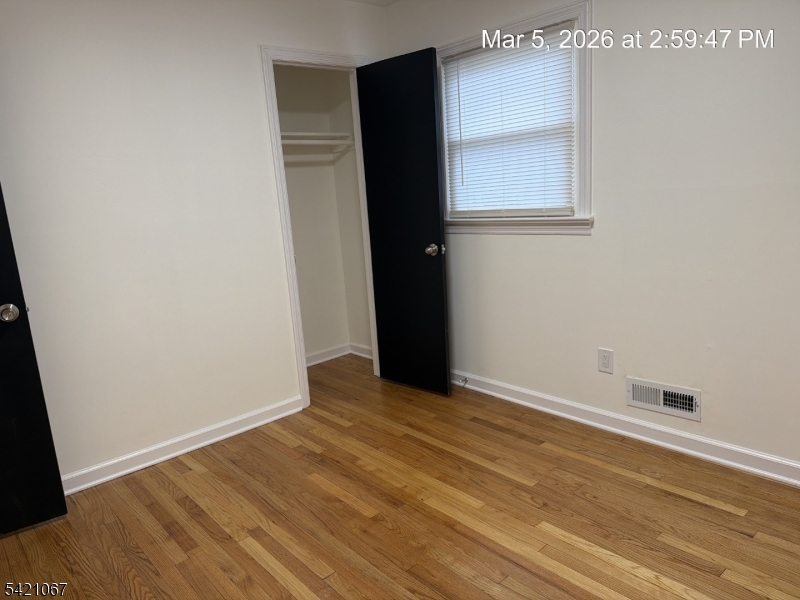 900 Smith Street, Unit 2 Linden, NJ 07036 - Photo 6 of 9 a view of an empty room with wooden floor