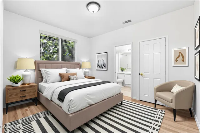 a bedroom with a bed and a couch