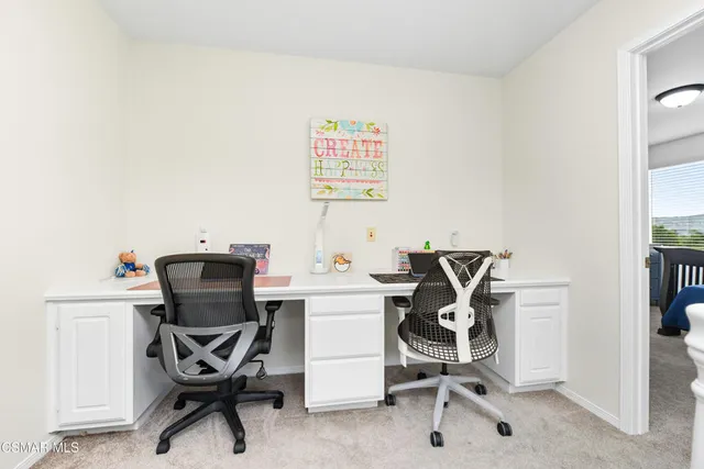 a view of a workspace with furniture