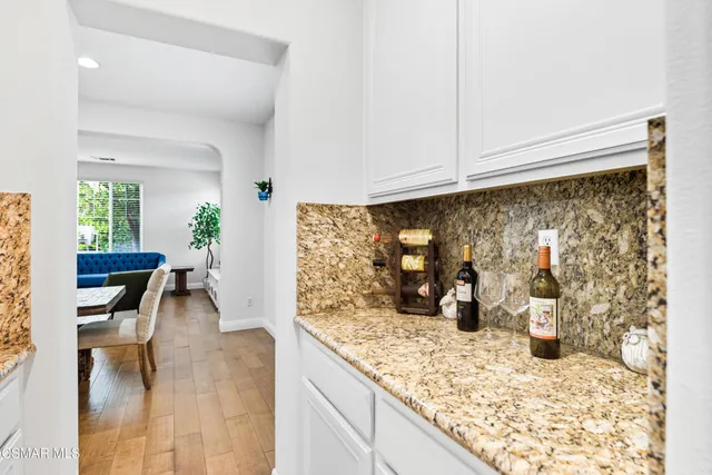 a view of a kitchen with dining table and chairs