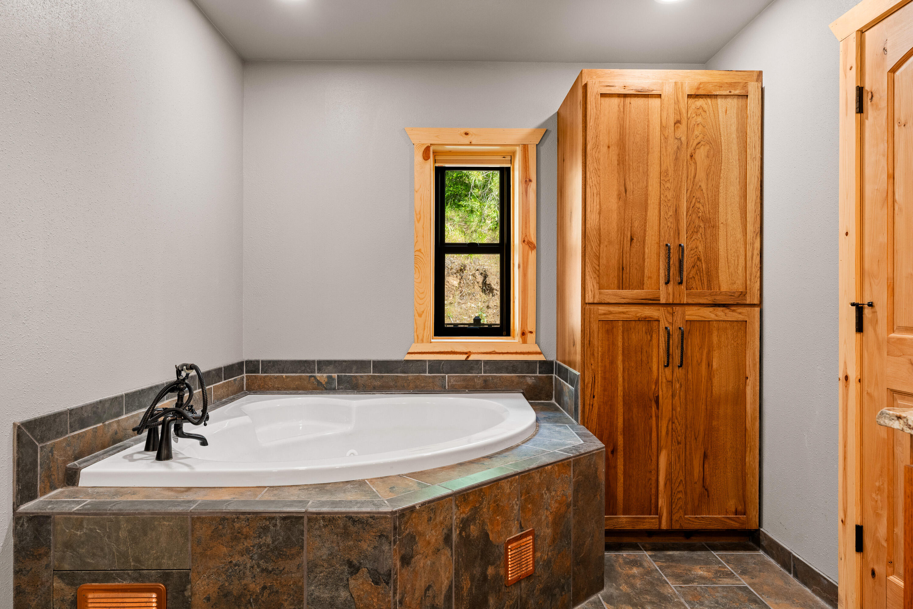 225 Eagle Ridge Road Canyonville, OR 97417 - Photo 41 of 52 a bathroom with a sink and a window