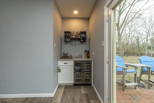 a room with a baby crib and a dresser