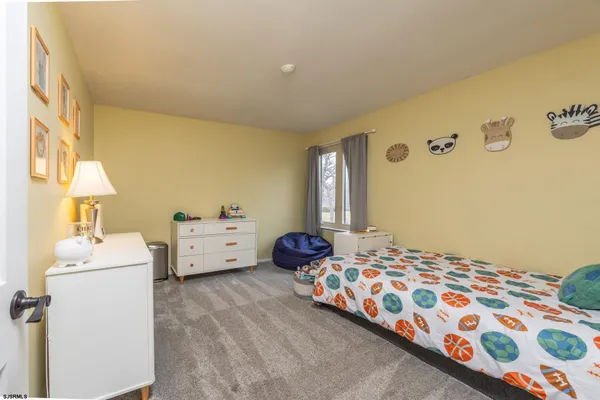 a spacious bathroom with a granite countertop sink mirror and shower