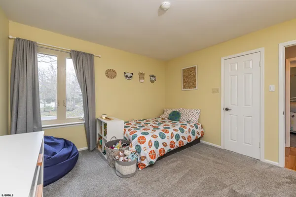 a view of walk in closet with clothes