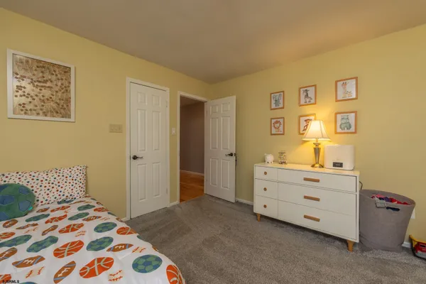 a bathroom with a granite countertop sink double and mirror