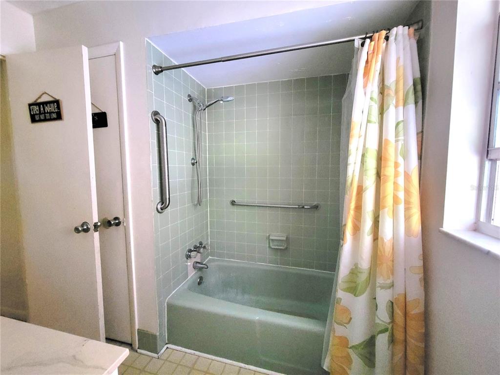 516 B Track Run Ocala, FL 34472 - Photo 16 of 41 a bathroom with a bathtub and a shower