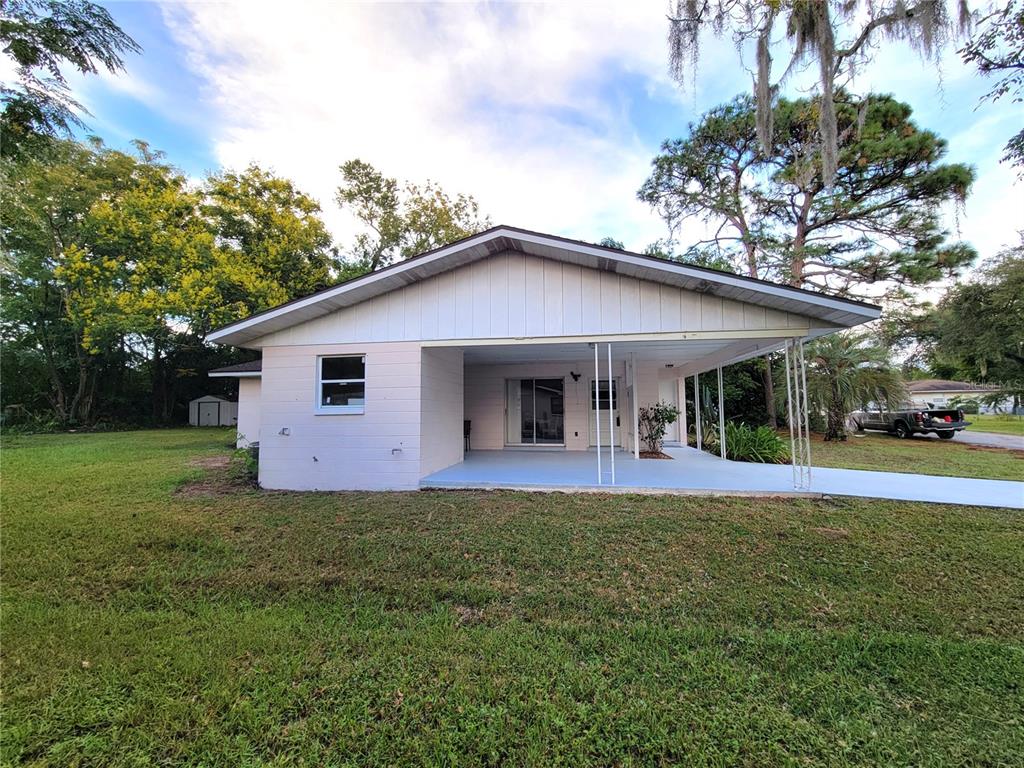 516 B Track Run Ocala, FL 34472 - Photo 28 of 41 a front view of a house with a garden