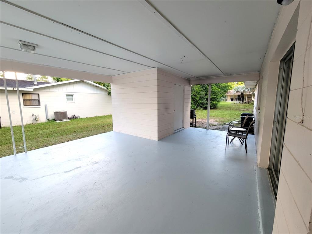 516 B Track Run Ocala, FL 34472 - Photo 4 of 41 a view of a porch with chairs and backyard