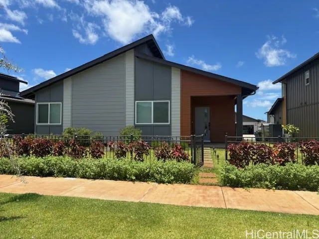 a view of a house with a yard and plants