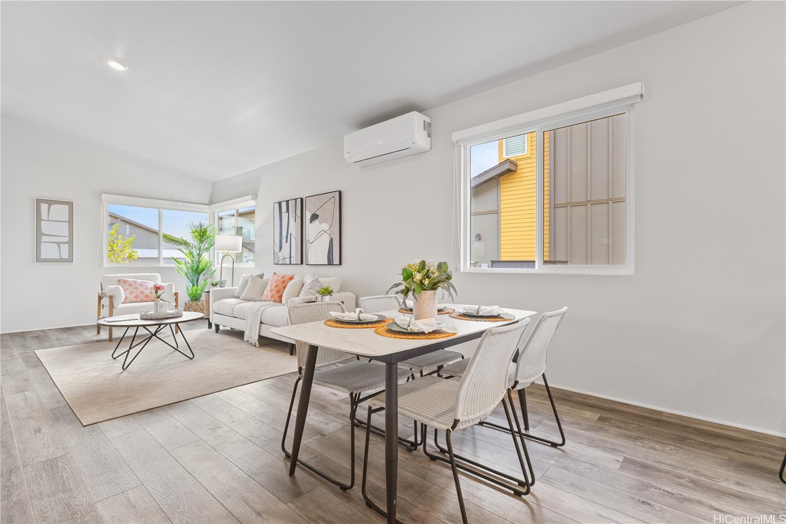 91-1816 Kohanahana Loop Ewa Beach, HI 96706 - Photo 16 of 25 a view of a livingroom and dining room with wooden floor kitchen view