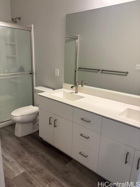 91-1816 Kohanahana Loop Ewa Beach, HI 96706 - Photo 9 of 25 a bathroom with a double vanity sink toilet and a mirror