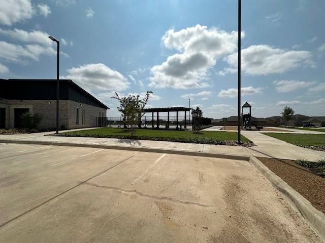 14032 Earlham Street Pilot Point, TX 76258 - Photo 23 of 32 a view of a house with a yard