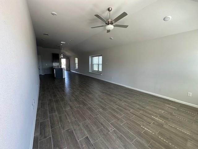 14032 Earlham Street Pilot Point, TX 76258 - Photo 29 of 32 an empty room with wooden floor and ceiling fan