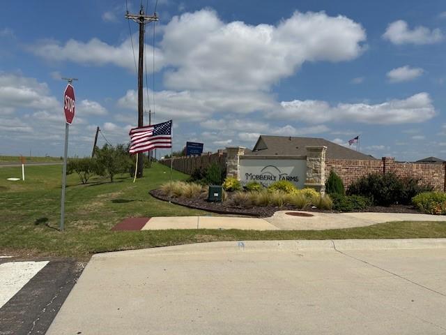 14032 Earlham Street Pilot Point, TX 76258 - Photo 3 of 32 a front view of a house with a garden and plants