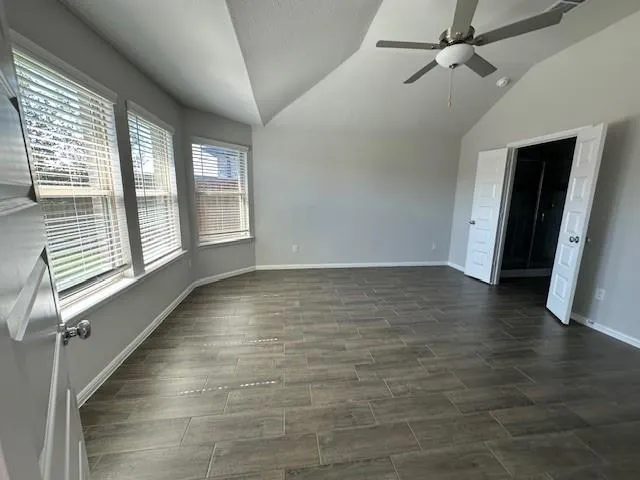 a view of room with window and hardwood floor