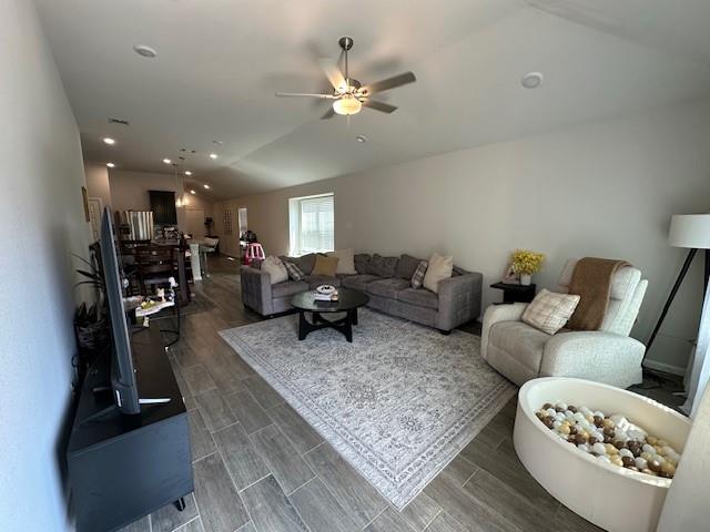 14032 Earlham Street Pilot Point, TX 76258 - Photo 8 of 32 a living room with furniture and a chandelier