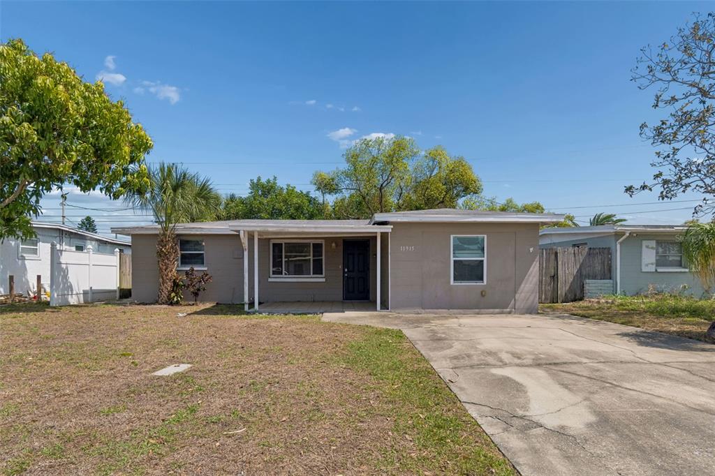11915 106th Street Largo, FL 33773 - Photo 1 of 1 a house with outdoor space
