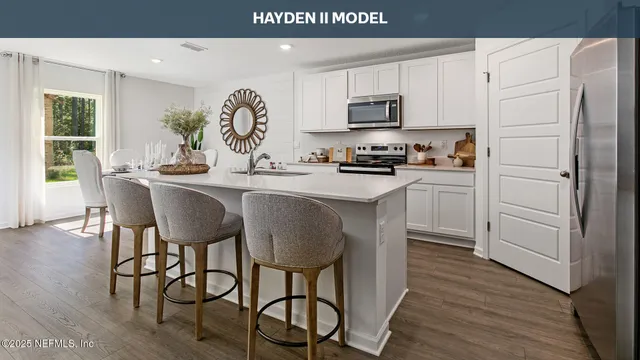 a kitchen with a sink and a refrigerator