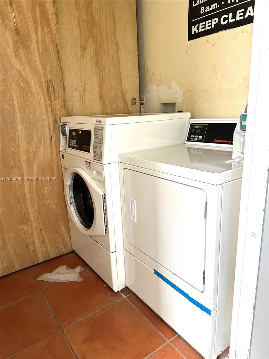 7256 Southwest 94th Place, Unit A4 Miami, FL 33173 - Photo 17 of 18 a utility room with dryer and washer