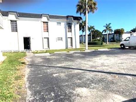 7256 Southwest 94th Place, Unit A4 Miami, FL 33173 - Photo 3 of 18 a view of a house with a yard