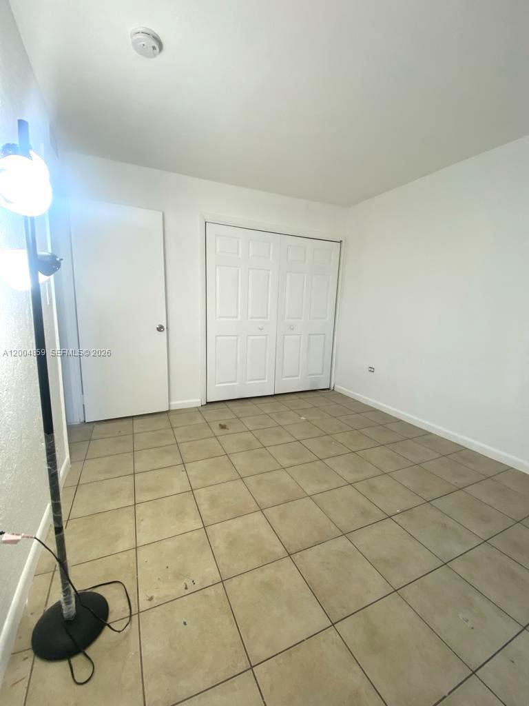 7256 Southwest 94th Place, Unit A4 Miami, FL 33173 - Photo 10 of 18 a view of a garage