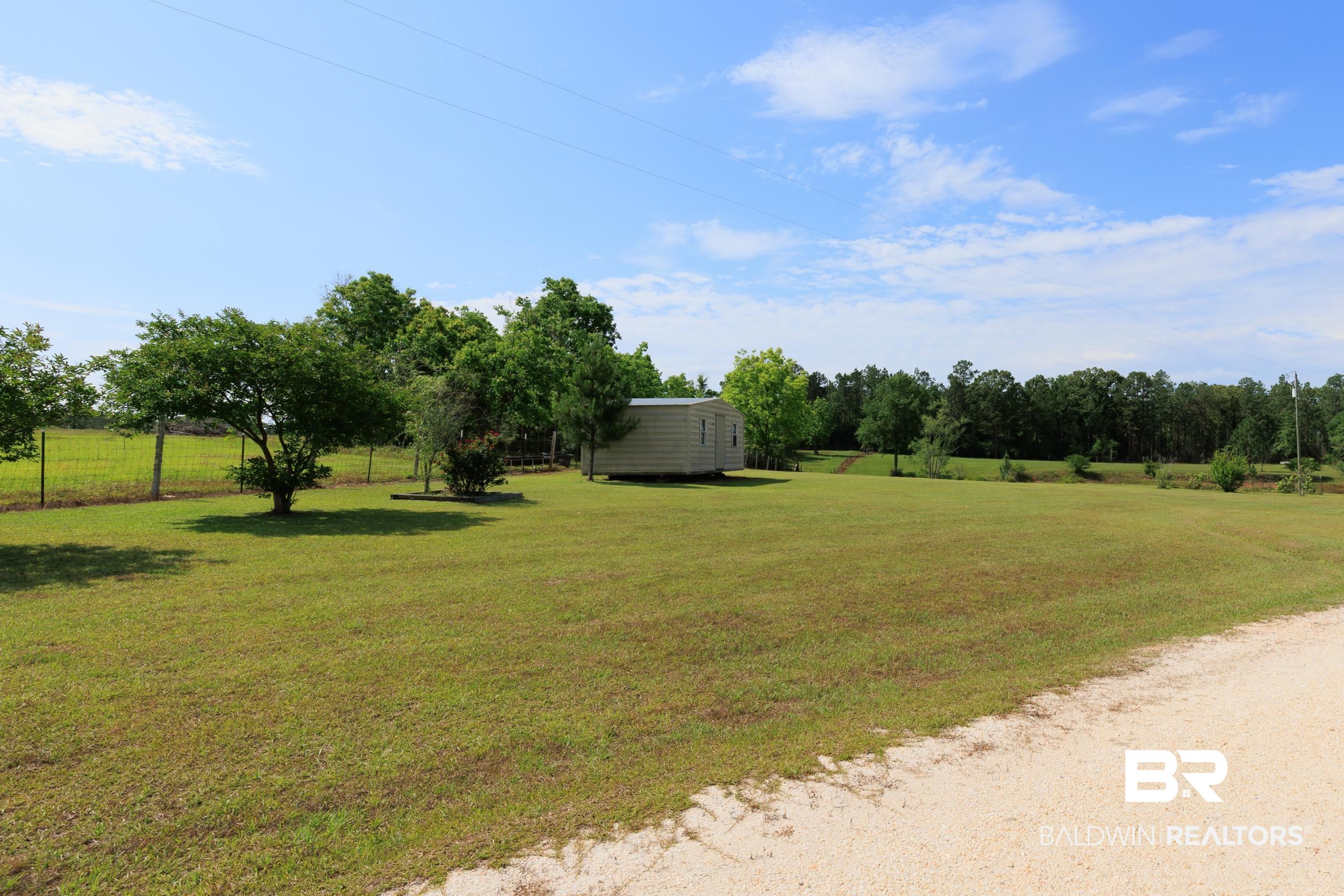6725 Upper Creek Road Flomaton, AL 36441 - Photo 16 of 61 View of green lawn