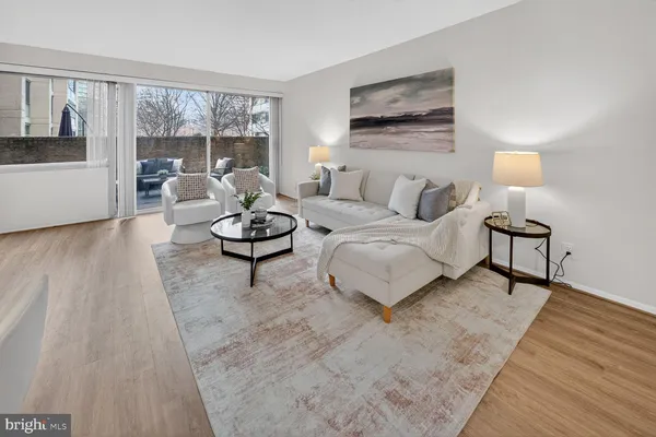 a living room with furniture and a large window