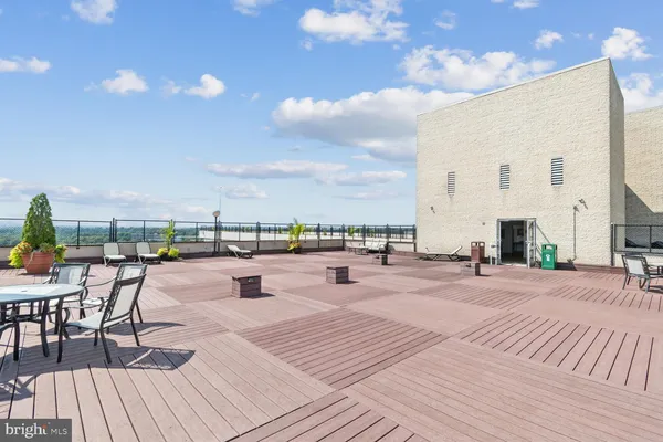 a view of entry way with wooden cabinet