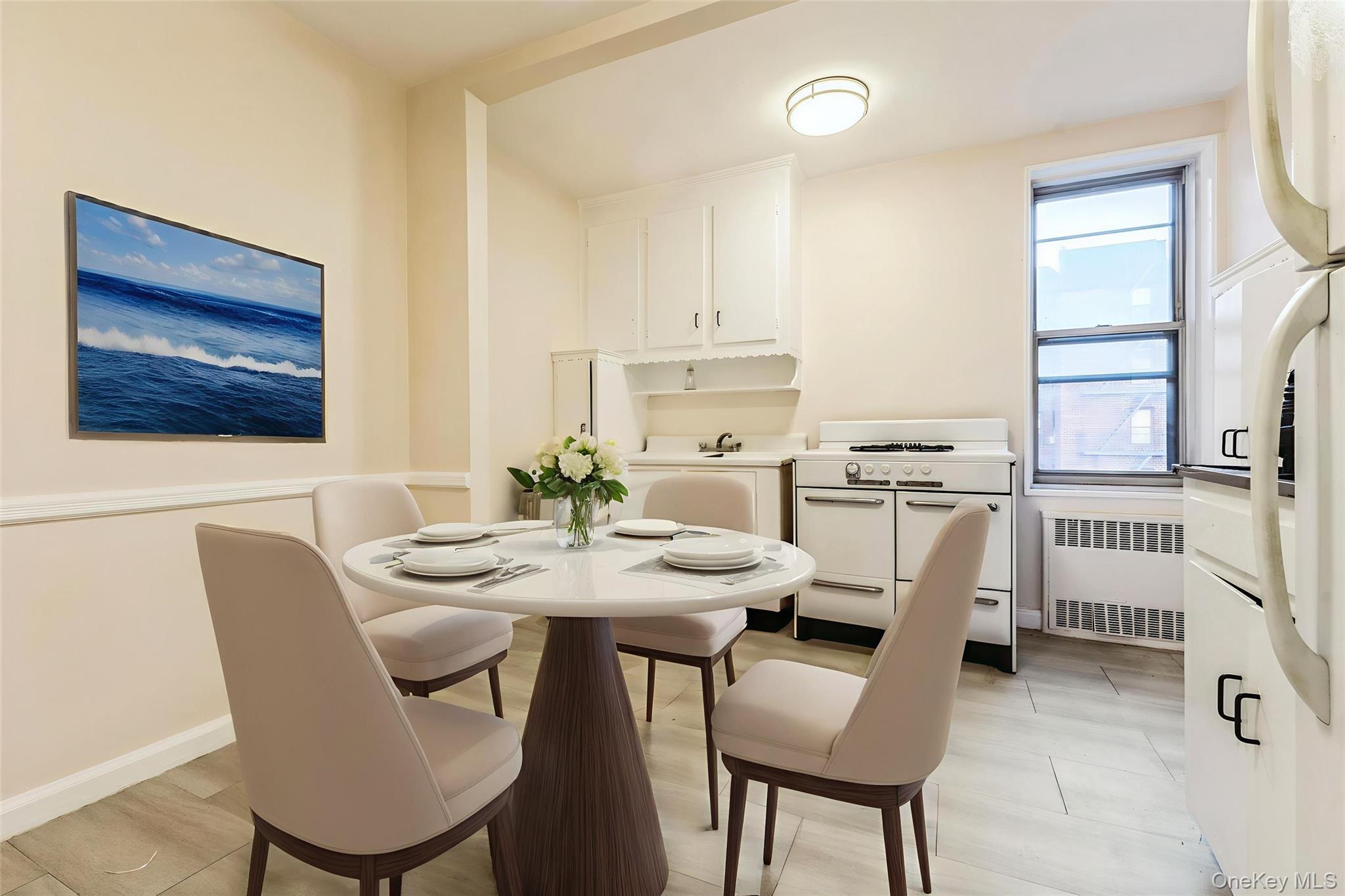 2232 Brigham Street, Unit EE4 Brooklyn, NY 11229 - Photo 5 of 16 Dining area featuring radiator and baseboards