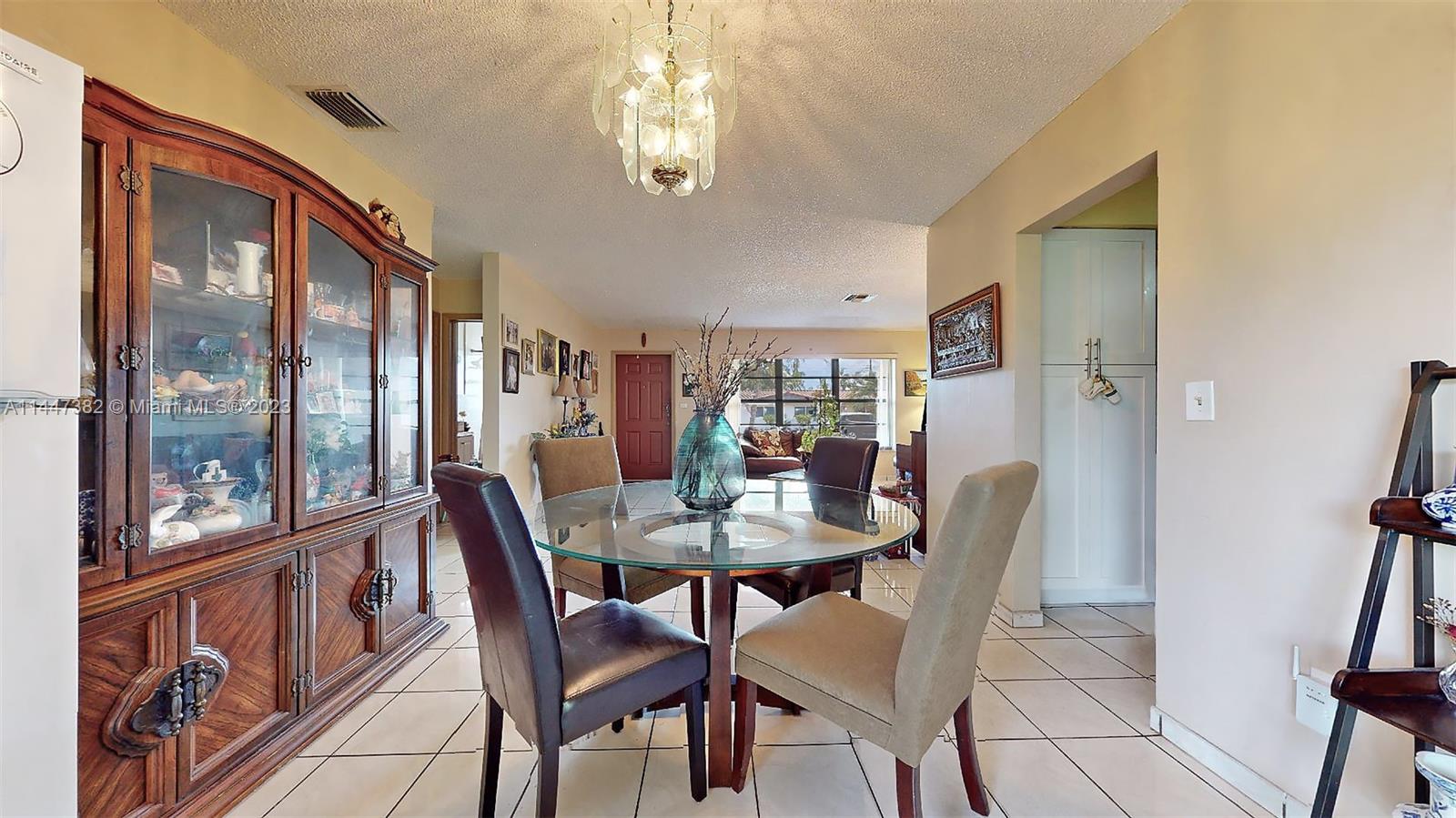 9815 Southwest 77th Street Miami, FL 33173 - Photo 13 of 30 a view of a dining room with furniture window and outside view