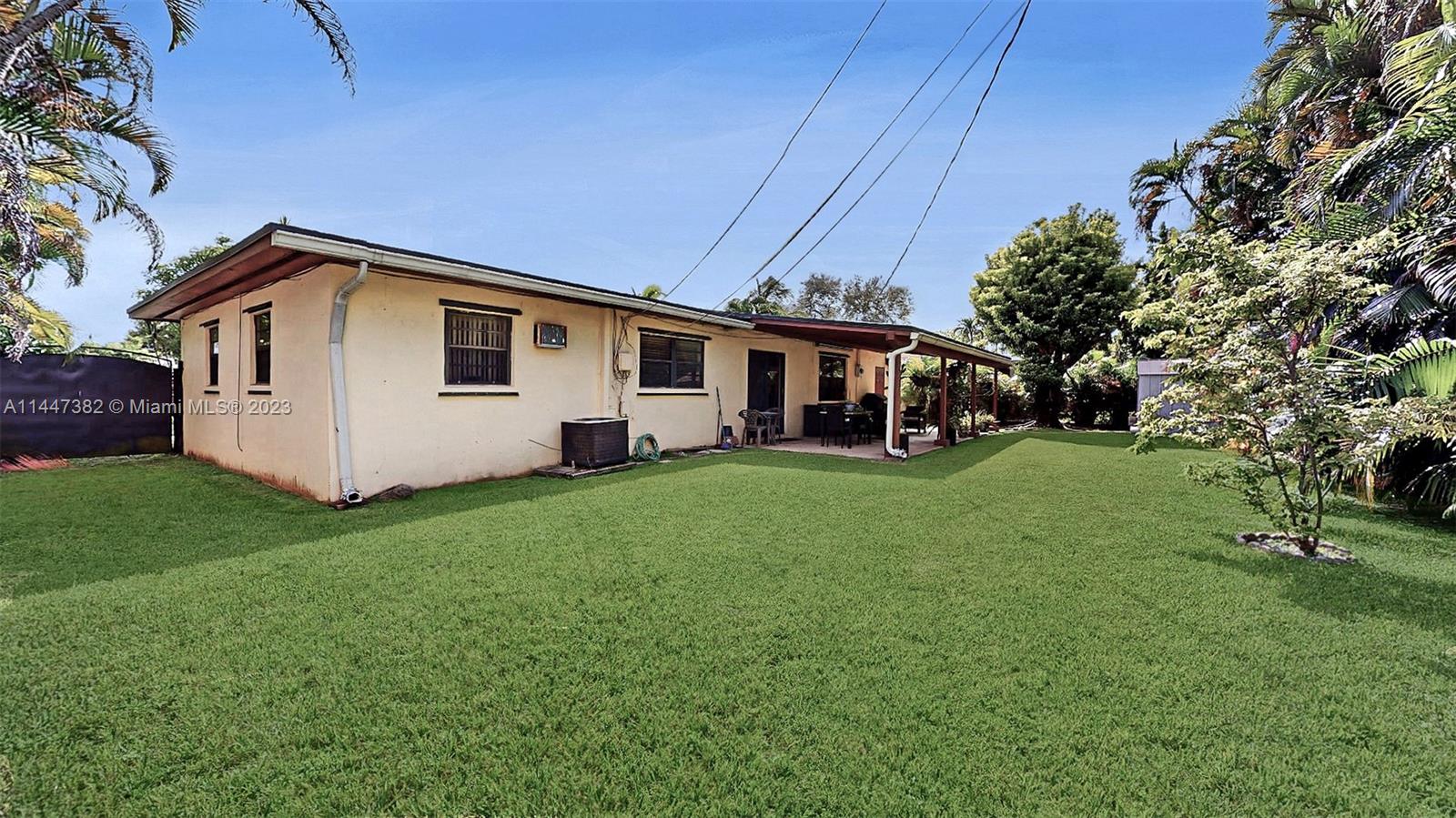 9815 Southwest 77th Street Miami, FL 33173 - Photo 21 of 30 a front view of house with yard and green space
