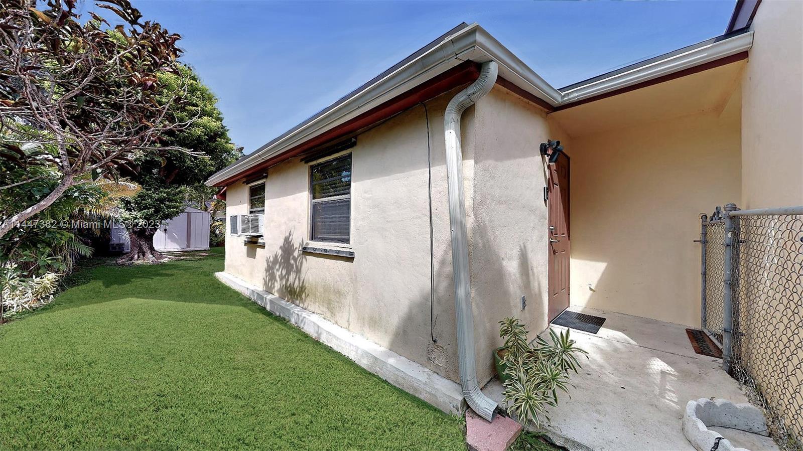 9815 Southwest 77th Street Miami, FL 33173 - Photo 22 of 30 a front view of a house with garden