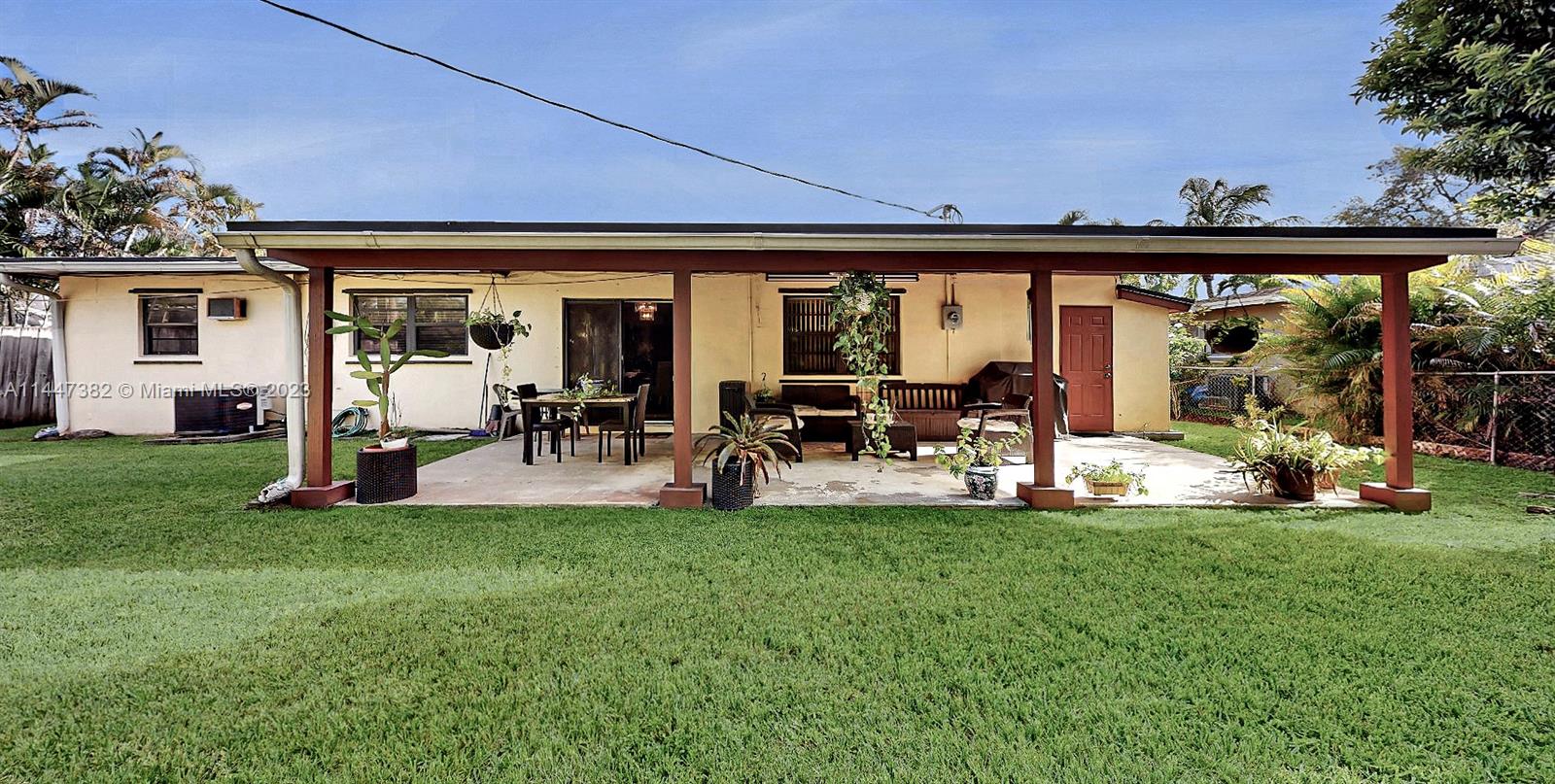9815 Southwest 77th Street Miami, FL 33173 - Photo 28 of 30 a view of a porch with furniture and garden