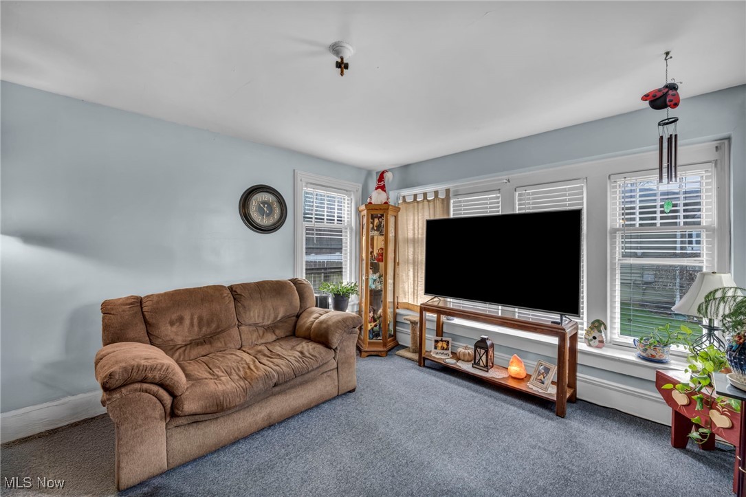 34 Old State Road North Norwalk, OH 44857 - Photo 21 of 31 Living room with carpet flooring and a healthy amount of sunlight