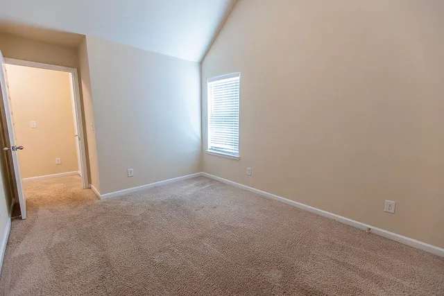 a view of swimming pool with a yard and mountain view in back